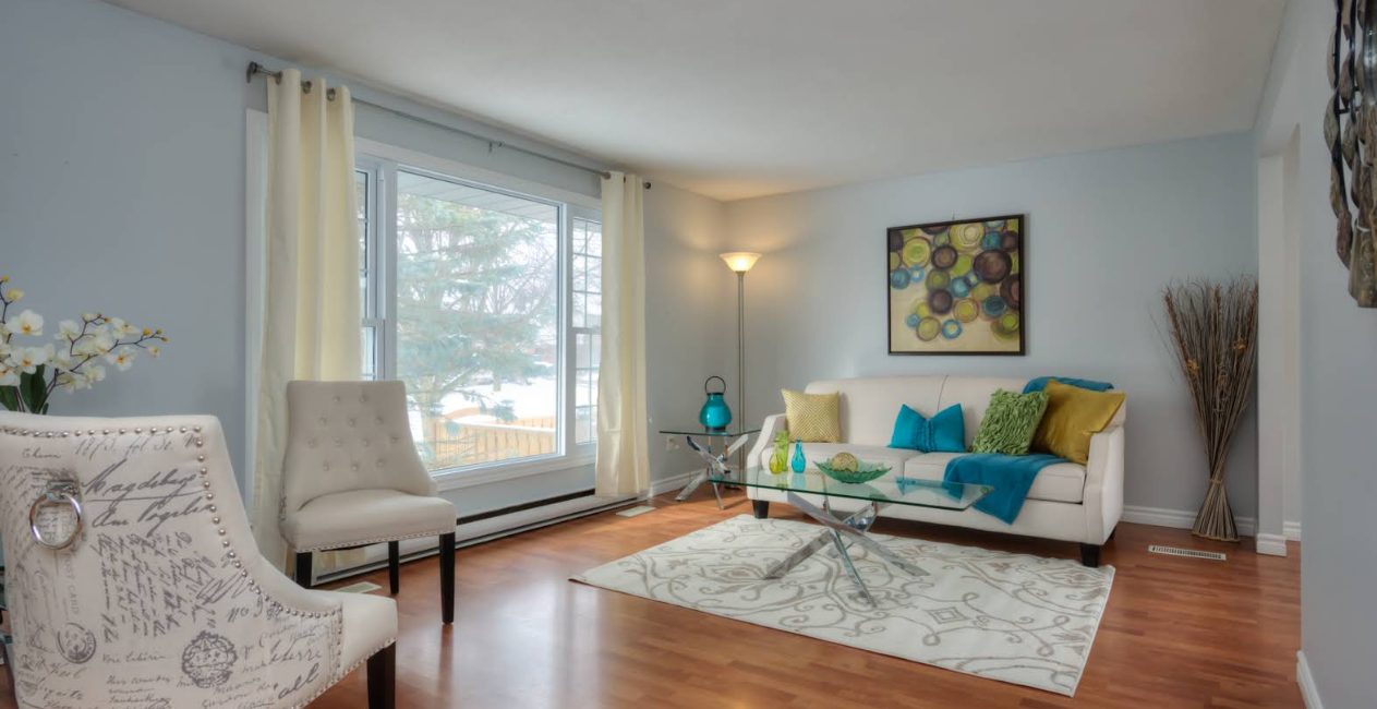 Bright living room styled by Bebo with teal accents